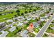 Aerial view of a neighborhood featuring well-maintained homes and mature trees at 608 Fort Duquesna Dr, Sun City Center, FL 33573