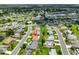 Aerial view of a neighborhood with well-manicured lawns and mature trees at 608 Fort Duquesna Dr, Sun City Center, FL 33573