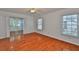 Spacious bedroom with hardwood floors and natural light at 608 Fort Duquesna Dr, Sun City Center, FL 33573