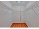 Empty closet with wire shelving and wood floors at 608 Fort Duquesna Dr, Sun City Center, FL 33573