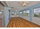 Bright sunroom featuring durable floors and multiple windows at 608 Fort Duquesna Dr, Sun City Center, FL 33573