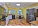 Bright kitchen with modern stainless steel appliances, sleek white cabinets and eat in breakfast nook at 608 Fort Duquesna Dr, Sun City Center, FL 33573