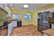Well-lit kitchen featuring modern stainless steel appliances and hardwood floors at 608 Fort Duquesna Dr, Sun City Center, FL 33573