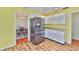 Well-equipped kitchen with modern stainless steel appliances and warm wood-look flooring at 608 Fort Duquesna Dr, Sun City Center, FL 33573