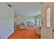Bright and airy living room with hardwood floors and a view to the front yard at 608 Fort Duquesna Dr, Sun City Center, FL 33573