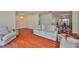 Open concept living room with hardwood floors flowing into the dining area at 608 Fort Duquesna Dr, Sun City Center, FL 33573