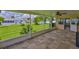 Enclosed patio area with tiled floors and a view of the backyard, and an exterior door to another room at 608 Fort Duquesna Dr, Sun City Center, FL 33573