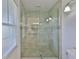 Bathroom shower with glass door and tile surround at 608 Fort Duquesna Dr, Sun City Center, FL 33573