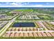 An aerial view of a well-planned community with ponds, manicured lawns, landscaping and convenient roadways at 6327 Positano Ct, Sarasota, FL 34243