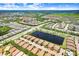 An aerial view of a well-planned community with ponds, manicured lawns, landscaping and convenient roadways at 6327 Positano Ct, Sarasota, FL 34243