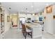 Bright, open kitchen with an island, stainless steel appliances, and bar stool seating at 6327 Positano Ct, Sarasota, FL 34243
