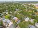 Aerial view of a residential neighborhood highlighting the lush greenery and dense tree cover at 711 S Bungalow Ter, Tampa, FL 33606