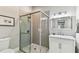 Bathroom featuring single vanity, a glass shower and modern fixtures and finishes at 711 S Bungalow Ter, Tampa, FL 33606
