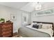 Cozy bedroom with decorative window and comfortable bedding at 711 S Bungalow Ter, Tampa, FL 33606