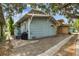 Charming exterior with wood siding and a small porch, offering a cozy and inviting curb appeal at 711 S Bungalow Ter, Tampa, FL 33606