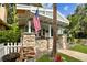 Inviting front porch with stone columns and an American flag displayed at 711 S Bungalow Ter, Tampa, FL 33606