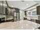 View of kitchen with stainless steel appliances, gray cabinets and marble countertops at 711 S Bungalow Ter, Tampa, FL 33606
