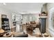 Open living room with hardwood floors, fireplace, and plenty of natural light at 711 S Bungalow Ter, Tampa, FL 33606