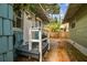 Exterior showcasing a small front porch with a white railing and a walkway, perfect for relaxing outdoors at 711 S Bungalow Ter, Tampa, FL 33606