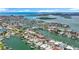 Breathtaking aerial view of the coastal community, showcasing stunning waterfront properties and waterways at 760 Capri Blvd, Treasure Island, FL 33706