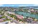 An aerial shot captures a waterfront neighborhood with stunning homes, private docks, and serene water, showcasing luxurious coastal living at 760 Capri Blvd, Treasure Island, FL 33706