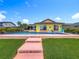 Beautiful backyard featuring a large pool, comfortable seating, and a well-maintained yard, ideal for outdoor enjoyment and relaxation at 760 Capri Blvd, Treasure Island, FL 33706