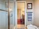 Bathroom showcasing a glass shower, toilet, and view to the vanity at 760 Capri Blvd, Treasure Island, FL 33706