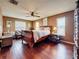 Bright bedroom with hardwood floors, and a ceiling fan at 760 Capri Blvd, Treasure Island, FL 33706