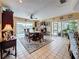 Elegant dining room with water views, a stylish rug, and ample seating for entertaining at 760 Capri Blvd, Treasure Island, FL 33706
