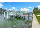 Scenic waterfront dock featuring boat lifts, offering easy boat storage and access to the water for boating and leisure activities at 760 Capri Blvd, Treasure Island, FL 33706