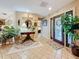 Welcoming entryway with neutral tile flooring, elegant decor, and a glimpse into the bedroom at 760 Capri Blvd, Treasure Island, FL 33706