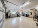 Well-organized garage features tile flooring, plenty of storage, and space for cars and projects at 760 Capri Blvd, Treasure Island, FL 33706