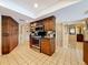 Well-lit kitchen with wooden cabinets, stainless steel oven, and ample storage space at 760 Capri Blvd, Treasure Island, FL 33706