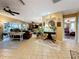 Spacious living room featuring tile floors, a ceiling fan, and an open layout at 760 Capri Blvd, Treasure Island, FL 33706