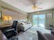 Comfortable office with a waterfront view, a ceiling fan, and a sofa for relaxation at 760 Capri Blvd, Treasure Island, FL 33706