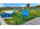 Beautiful playground featuring modern play equipment, including slides, climbers, swings and vibrant, colorful accents at 760 Capri Blvd, Treasure Island, FL 33706