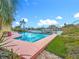 A backyard oasis featuring a sparkling pool with waterfront views, offering the perfect blend of relaxation and entertainment at 760 Capri Blvd, Treasure Island, FL 33706