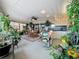 Charming sunroom filled with plants, a dining set, and plenty of natural light for relaxation at 760 Capri Blvd, Treasure Island, FL 33706
