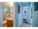 Bathroom with a vanity, toilet, tub and shower combination leading to the bedroom at 7699 92Nd St, Seminole, FL 33777