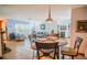 Inviting dining area with a table set for four, open to the living room and kitchen at 7699 92Nd St, Seminole, FL 33777