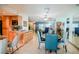 Dining room view featuring a round table with blue dining chairs, and adjacent kitchen area at 7699 92Nd St, Seminole, FL 33777