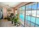Relaxing living room with a view of the pool through large sliding glass doors at 7699 92Nd St, Seminole, FL 33777
