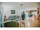 Open-concept living room with tile floors, neutral walls, and a view into the dining area at 7699 92Nd St, Seminole, FL 33777