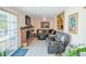 Comfortable living room with a brick fireplace and stylish gray sofa at 7699 92Nd St, Seminole, FL 33777