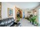 Spacious living room features a stone archway and a glimpse of the dining area at 7699 92Nd St, Seminole, FL 33777