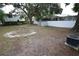 A large backyard with plenty of space, partially fenced in, and offers ample space to relax and unwind at 8405 N Willow Ave, Tampa, FL 33604