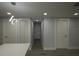 Finished basement area features modern lighting and multiple doorways at 8405 N Willow Ave, Tampa, FL 33604