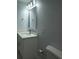 Bathroom vanity with quartz countertop, undermount sink, and modern faucet at 8405 N Willow Ave, Tampa, FL 33604
