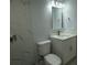 Modern bathroom featuring marble tiling and updated fixtures at 8405 N Willow Ave, Tampa, FL 33604