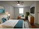 Bright bedroom features a cozy chair and contemporary decor with a TV at 8405 N Willow Ave, Tampa, FL 33604